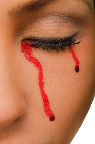 Blood flows from closed eyes of the woman Stock Image