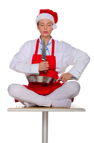 Meditating cook with dishes — Stock Photo, Image