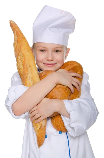 Merry baker with three loaves of bread — Stock Photo, Image