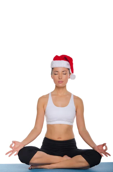 Azian meditating in a red cap — Stock Photo, Image