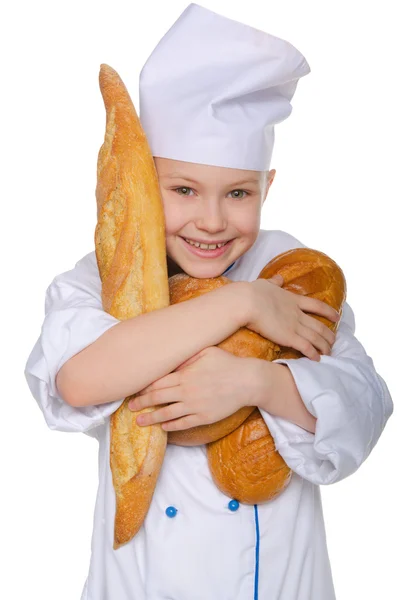 Laughing baker with three loaves of bread — Stock Photo, Image