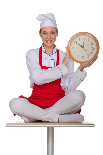 Smiling chef holding a clock — Stock Photo, Image