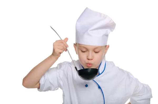 Cook blowing on soup — Stock Photo, Image