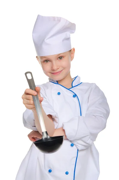 Jonge chef-kok met een pollepel — Stockfoto