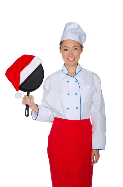 Asian chef with frying pan in Santa hat — Stock Photo, Image