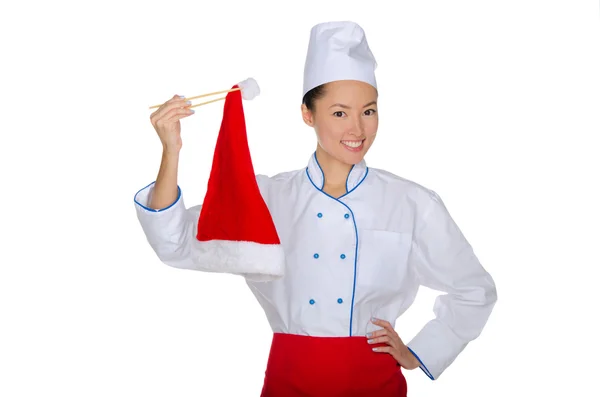 East chef holding chopsticks Santa hat — Stock Photo, Image