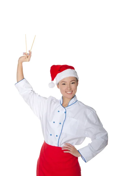 Asian in Santa Claus hats held up chopsticks — Stock Photo, Image