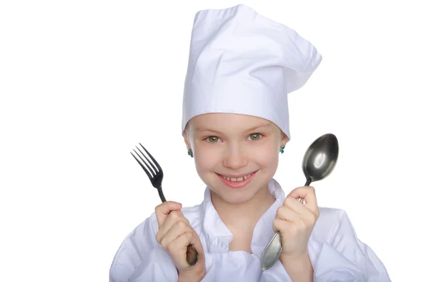 Jeune chef avec fourchette et cuillère — Photo