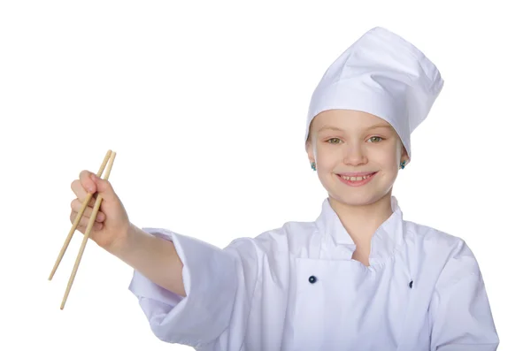 Girl in the form of chef with chopsticks — Stock Photo, Image