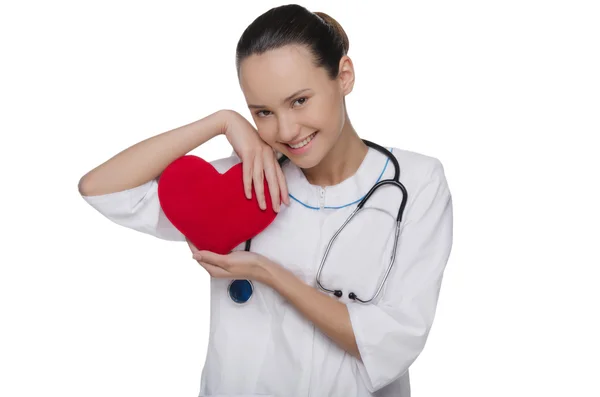 Doctor with stethoscope covers heart — Stock Photo, Image