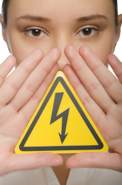 Young woman holding a yellow triangle