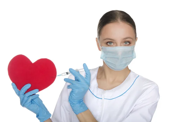 Doctor in mask tunic red heart symbol — Stock Photo, Image