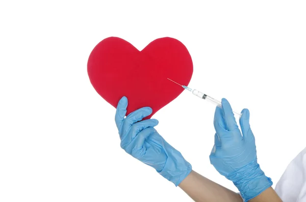 Hand with medical glove makes shot in the heart — Stock Photo, Image