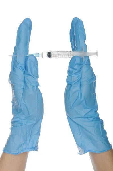 Hands in gloves demonstrate a syringe — Stock Photo, Image