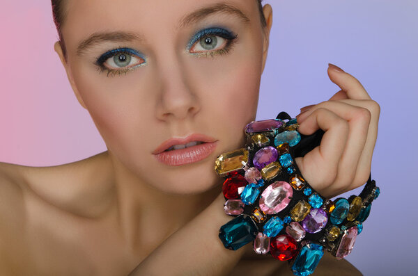 Woman with a bracelet of colored stones