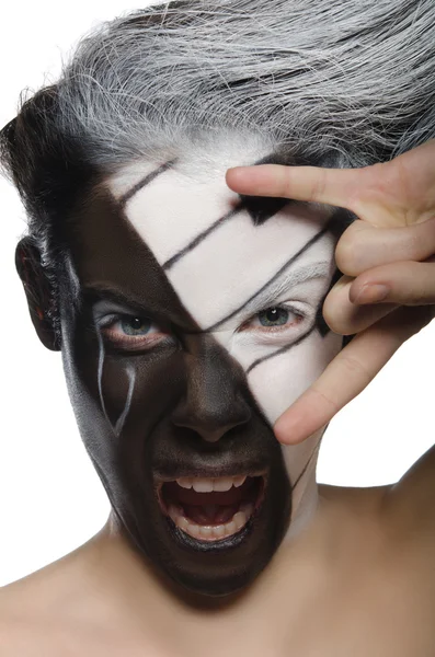 Screaming woman with face art and rock gesture — Stock Photo, Image