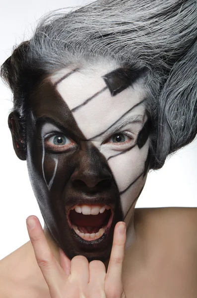 Portrait with musical makeup and rock gesture — Stock Photo, Image