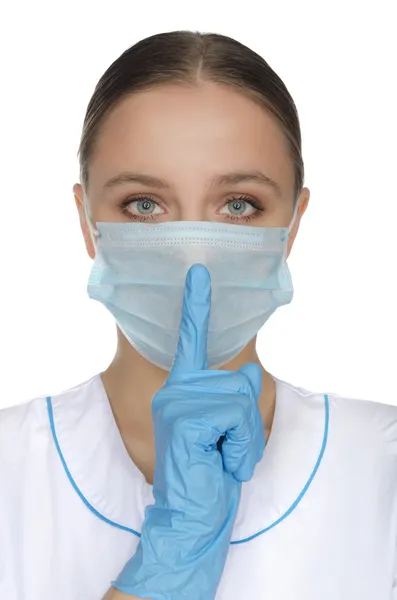 Doctor in mask and with your finger from the lips — Stock Photo, Image