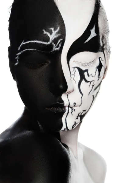 Portrait of woman with black and white face art — Stock Photo, Image