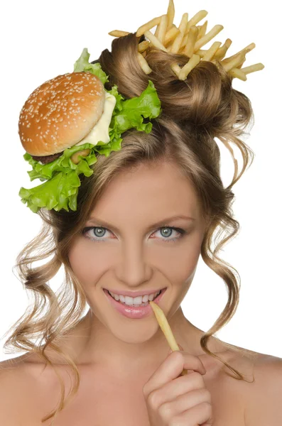 Woman holding slice of potato at mouth — Stock Photo, Image