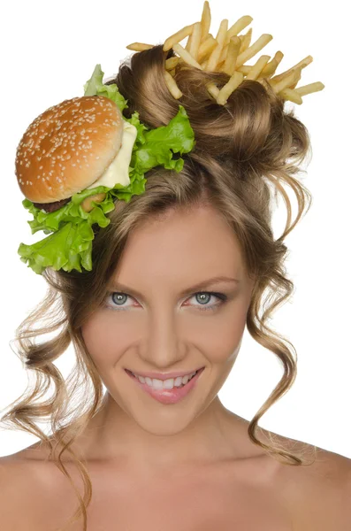 Vrouw met hamburger en friet glimlachen Stockfoto
