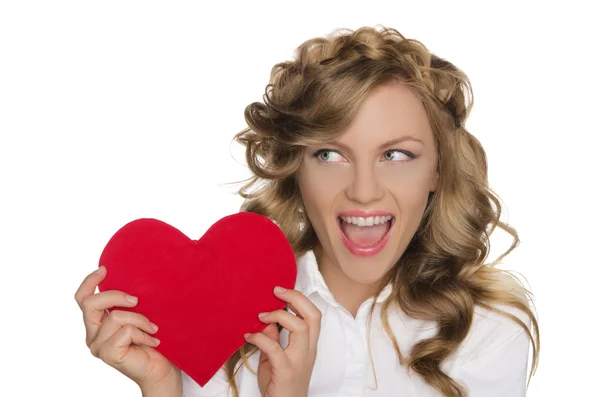 Woman holding heart next to him and looks away — Stock Photo, Image