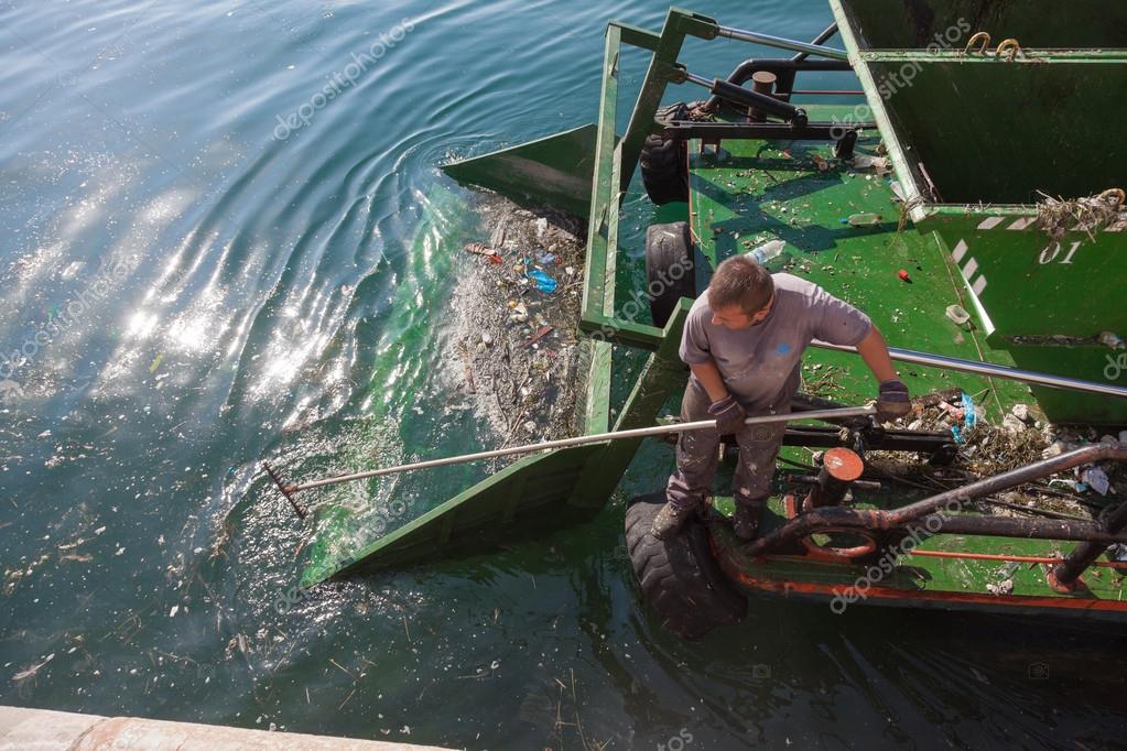 Water surface cleaning boat Stock Editorial Photo © portokalis 22660725