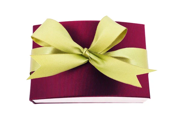 Dark red gift box with a green bow on white background — Stock Photo, Image