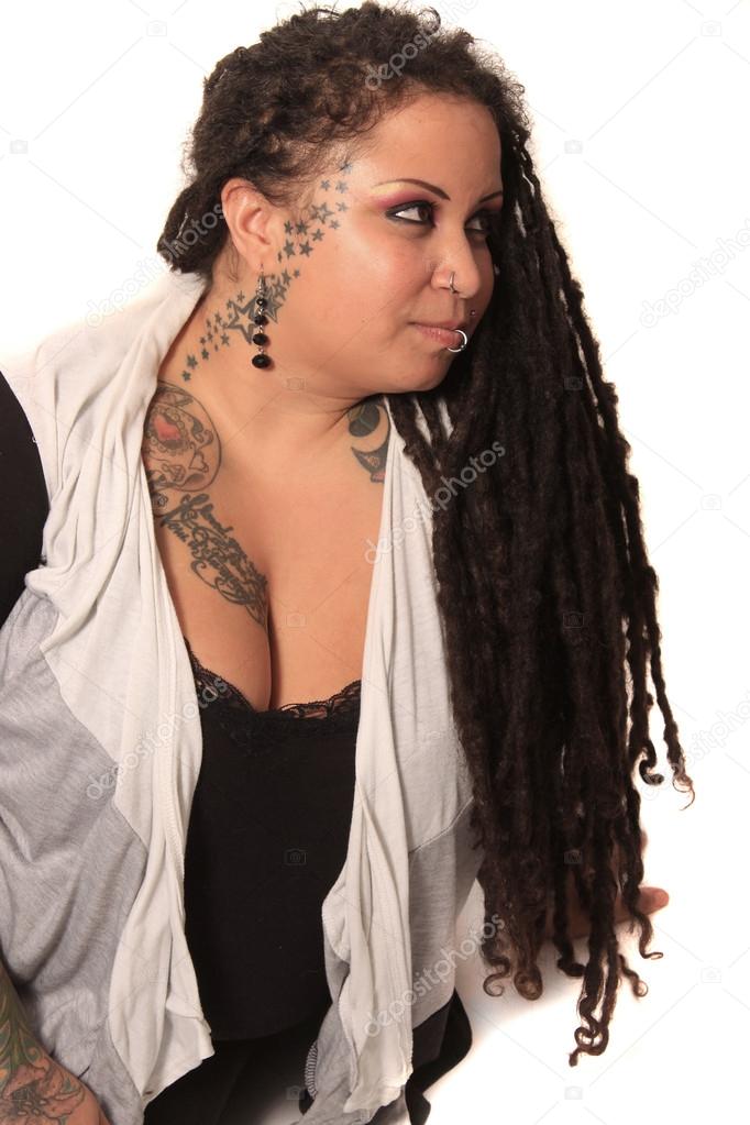 Tattooed Woman With Piercings And Dreadlocks Stock Photo