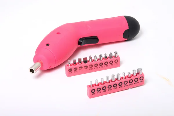 Destornillador inalámbrico rosa y trozos —  Fotos de Stock