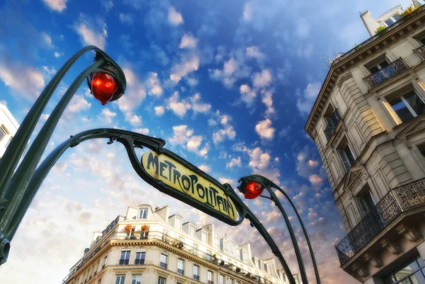 Paris. Underground Metro sign with buildings and sunset colors — Stock Photo, Image