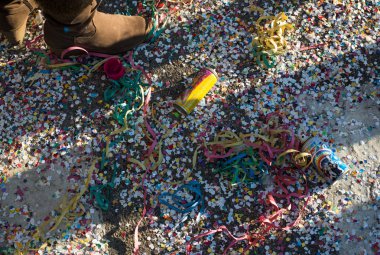 Colorful confetti and streamers at the street after Carnival Par clipart