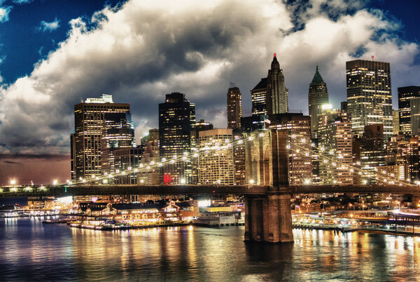 Amazing New York Cityscape - Skyscrapers and Brooklyn Bridge at sunset - USA