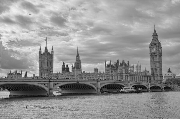 London, UK - Palace of Westminster (Houses of Parliament) with Big Ben clock tower and Westminster bridge over Thames river.
