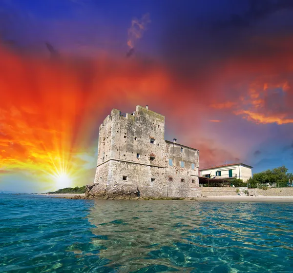 Ancient Tower over the Ocean at sunset — Stock Photo, Image