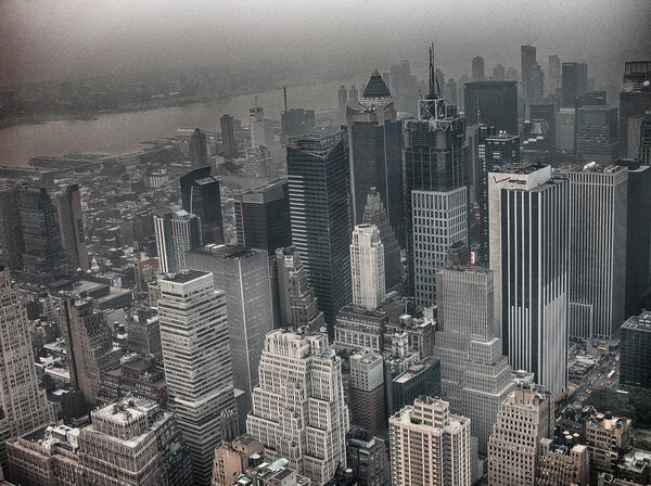 Manhattan, NYC. Wonderful skyline aerial view on a foggy day.