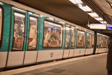 PARIS, DEC 4: Underground train inside a metro station, December clipart