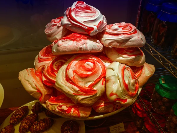 Colourful tasty meringues with cherry juice — Stock Photo, Image