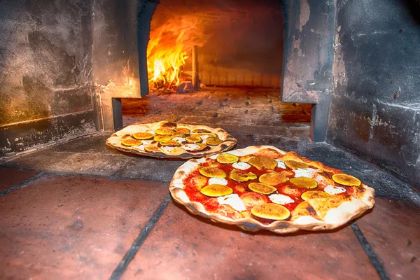 Pizzas baked in wood oven