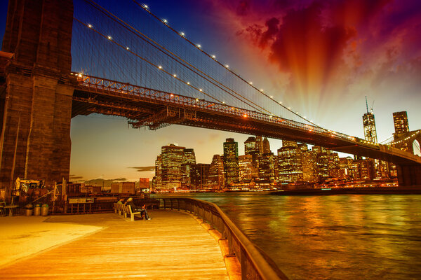 Brooklyn Bridge at dusk with Manhattan skyline, beautiful sky co