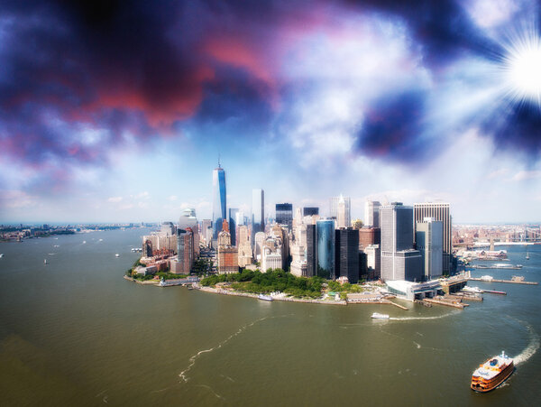 Sunset over New York skyline. Beautiful aerial view from helicopter.