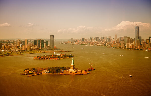 The Statue of Liberty, Manhattan and Jersey City skyline, aerial view.