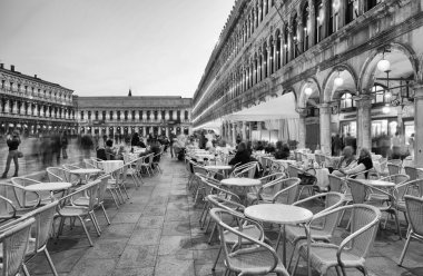 Tourists enjoy cafe in Piazza San Marco clipart