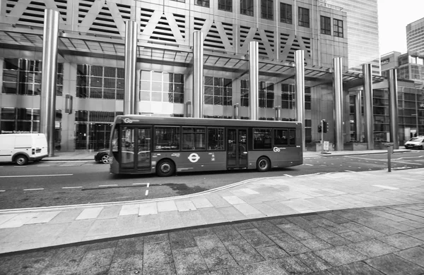 Modern red double decker bus speeds up — Stock Photo, Image