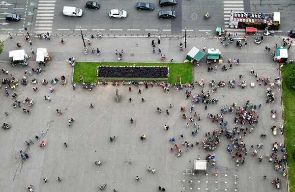 Crowd at the base of Eiffel Tower.