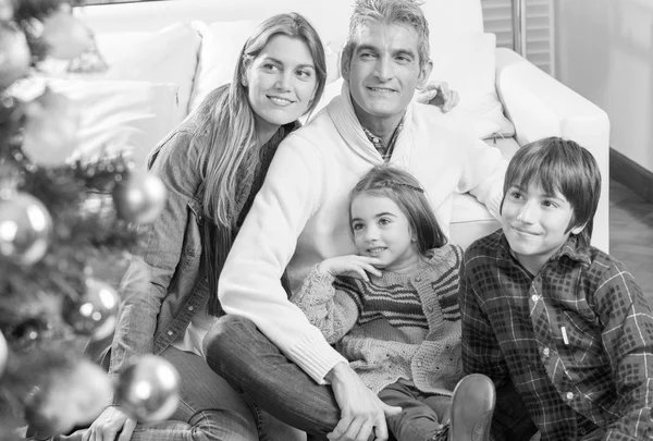 Happy family enjoying Christmas tree — Stock Photo, Image