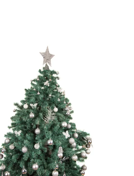 Árbol de Navidad con bolas y estrella en la parte superior —  Fotos de Stock