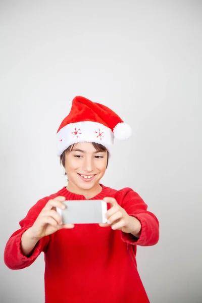 Young Boy Wearing Christmas Hat Taking Selfie White Background — Stock Photo, Image