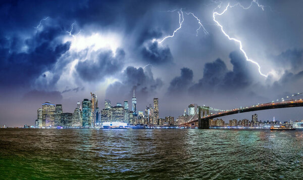 Amazing stormy night sky over Lower Manhattan, New York City - USA