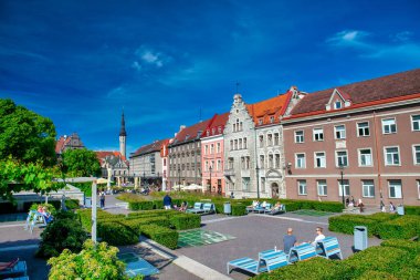 TALLINN, ESTONIA - JULY 15, 2017: Tourists enjoy relax time in Vanalinna Uisupark on a sunny day